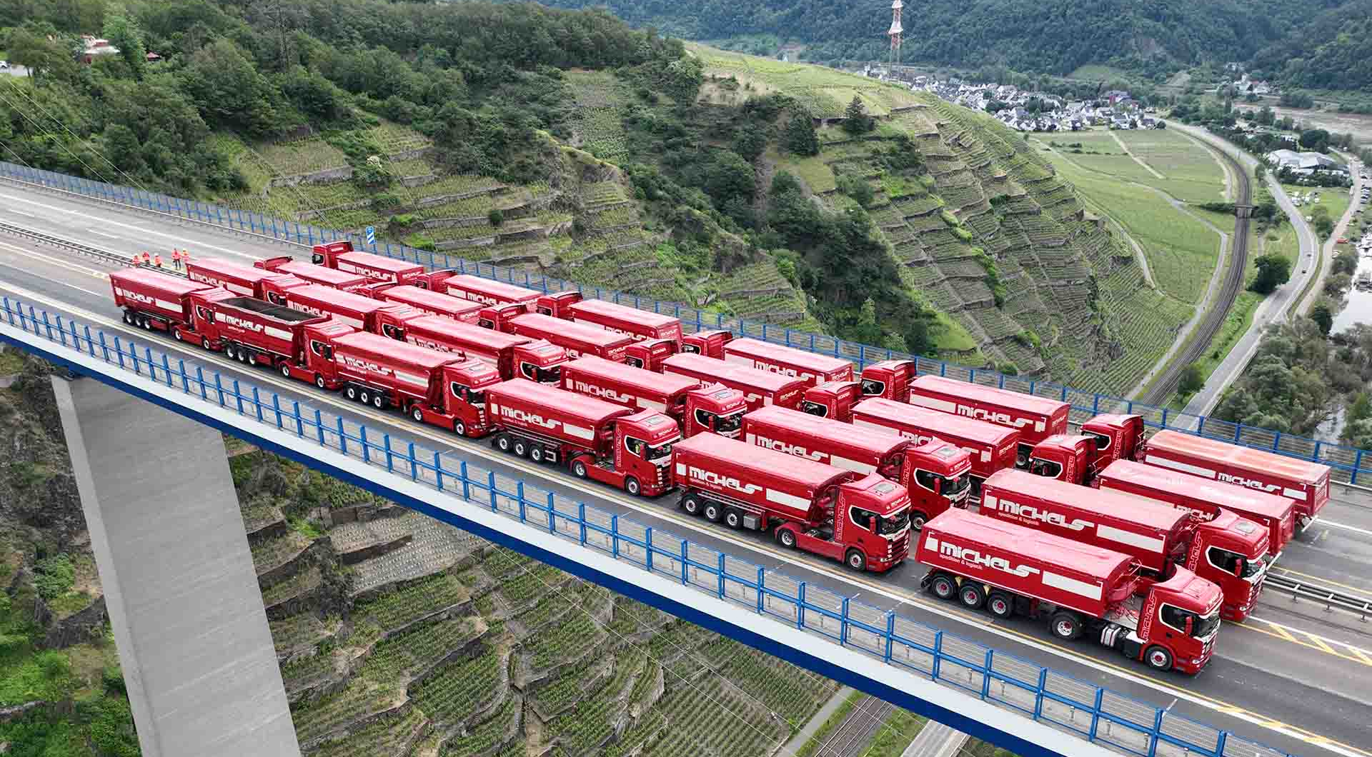 Many Michels trucks on Mosel valley bridge motorway