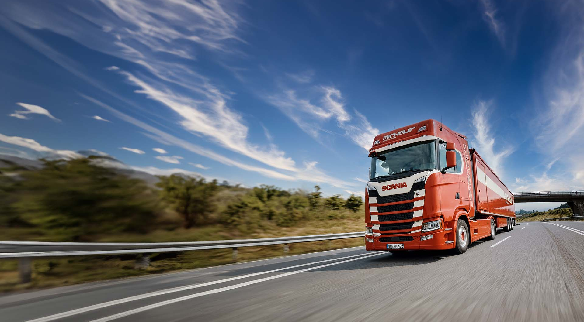 Red truck country road logistics