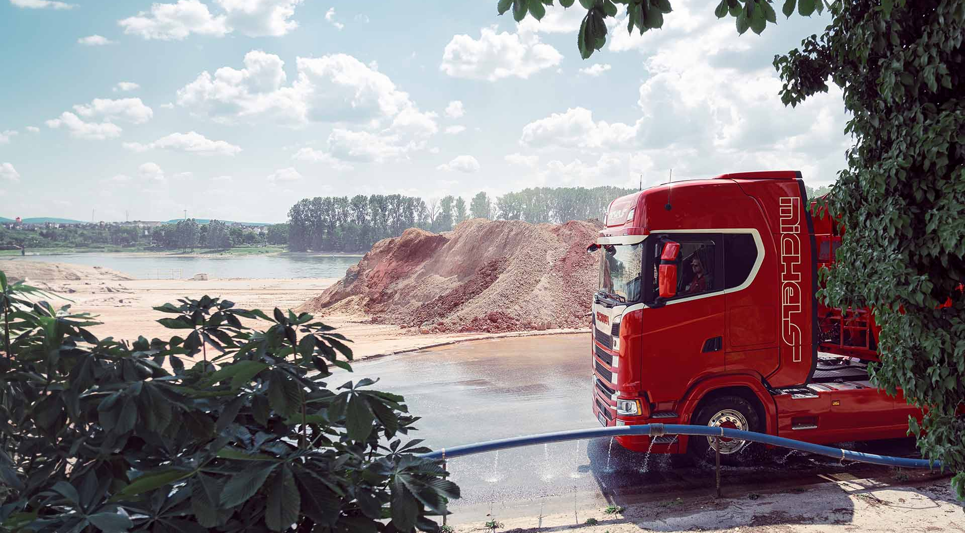Truck wheels are washed on construction site